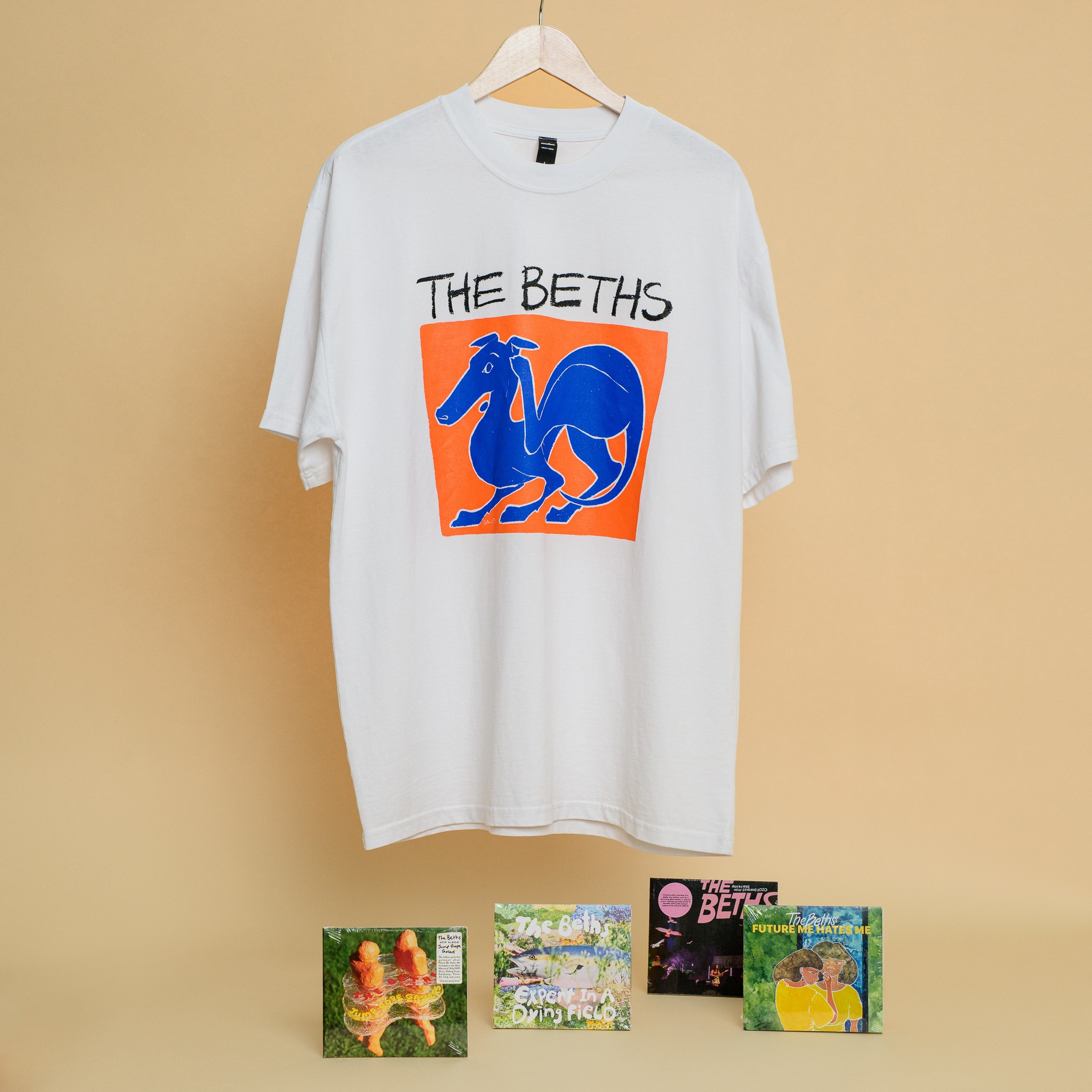 A t-shirt with four CDs