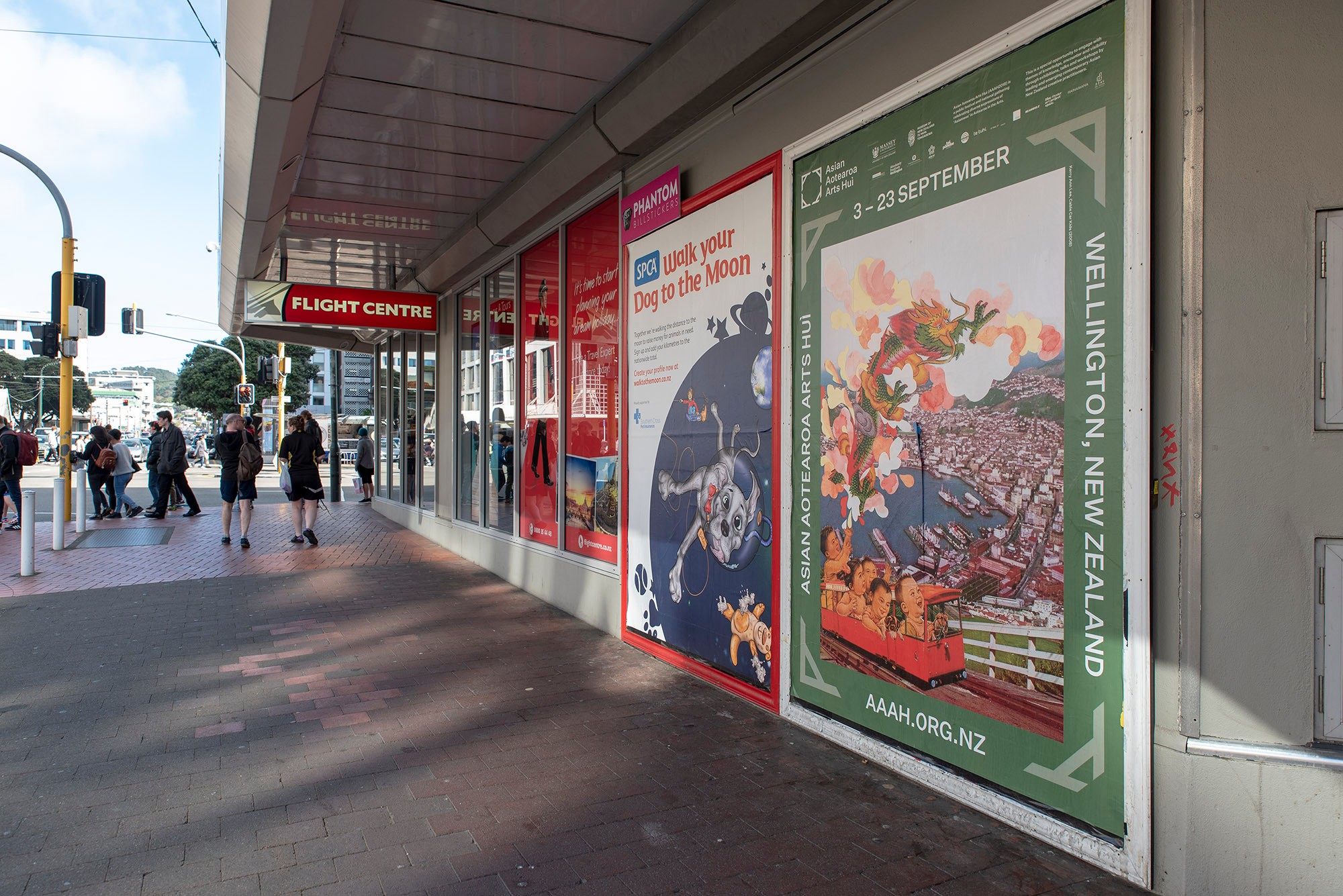 Large street posters on the side of a building.