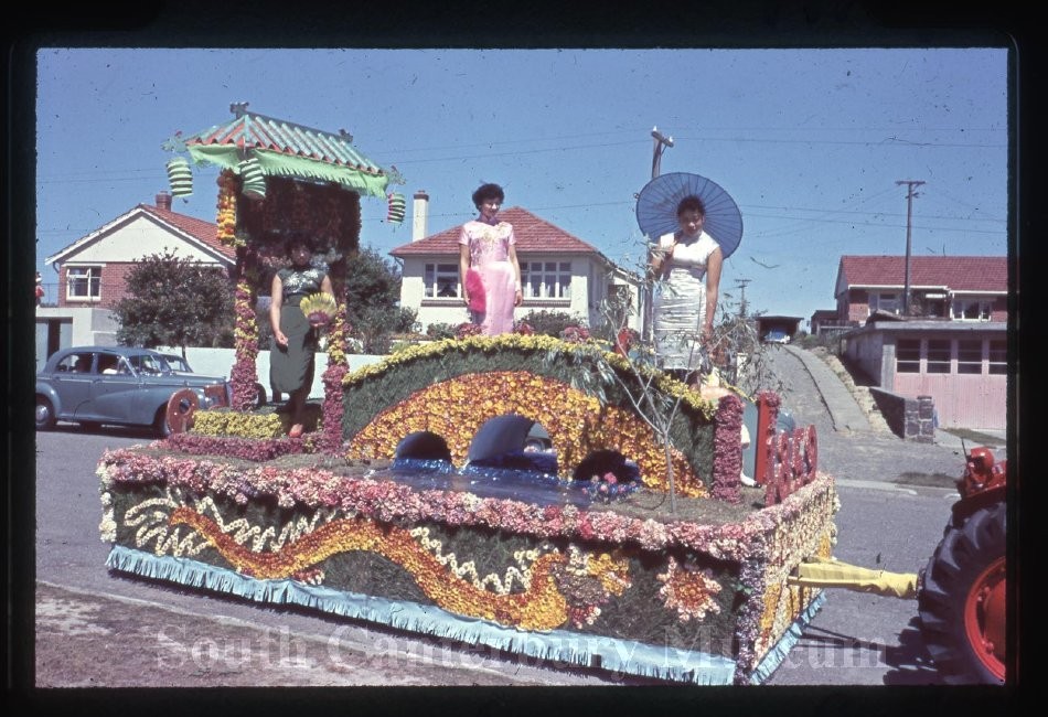 Women on a decorated parade float.