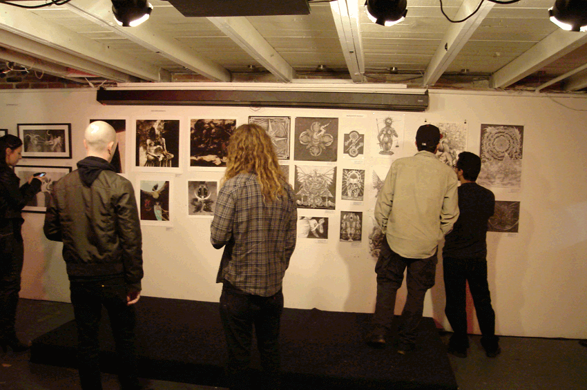 People are looking at an art exhibition.