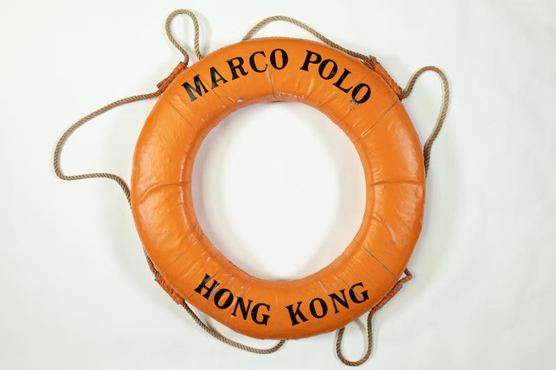 Orange life ring from a ship, which reads "Marco Polo Hong Kong".