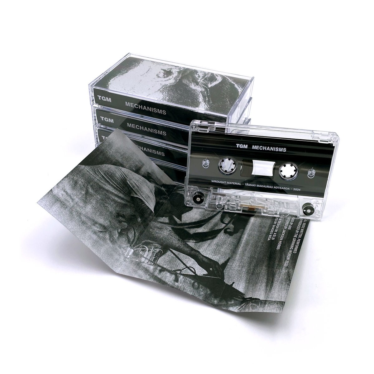 A promotional photo of a cassette with detailed black and white illustrations on the cover.