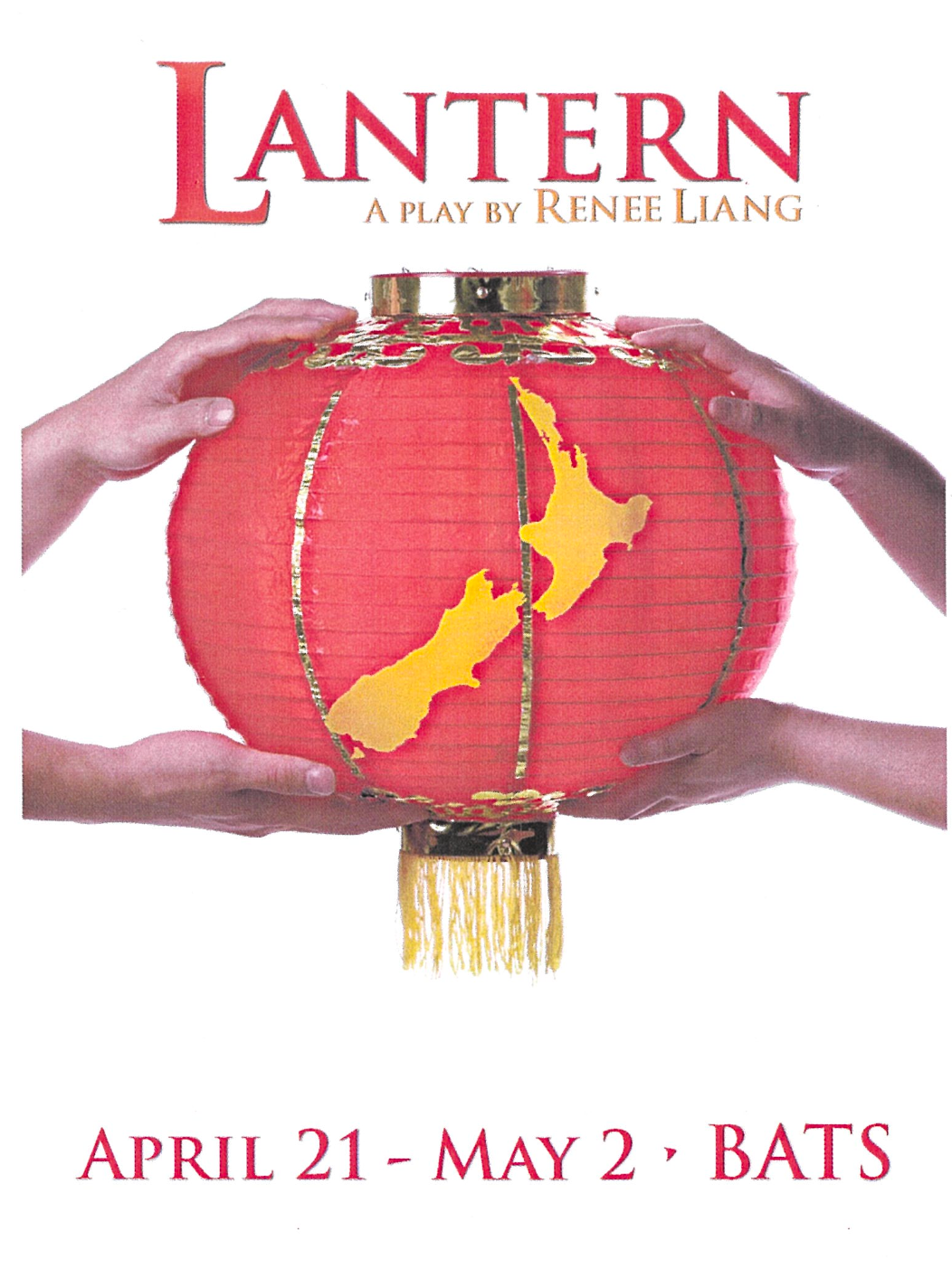 Two hands holding a red chinese lantern with a map of New Zealand painted on it in yellow