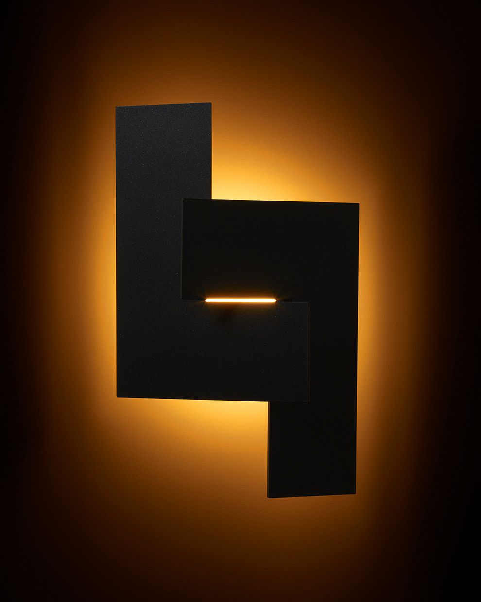 Glyph sconce on a dark background