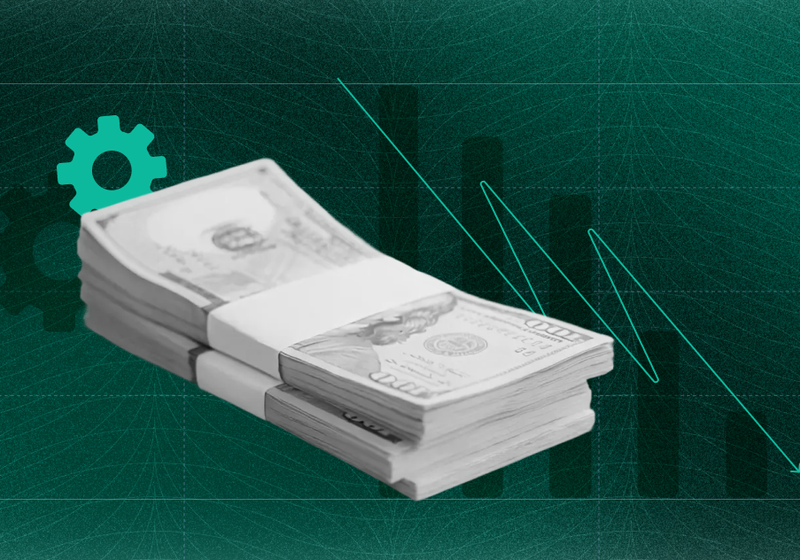 Stacks of hundred-dollar bills in front of a dark green background with a teal gear icon and a declining bar chart with a downward arrow, illustrating the falling cost and risk of automated verification.