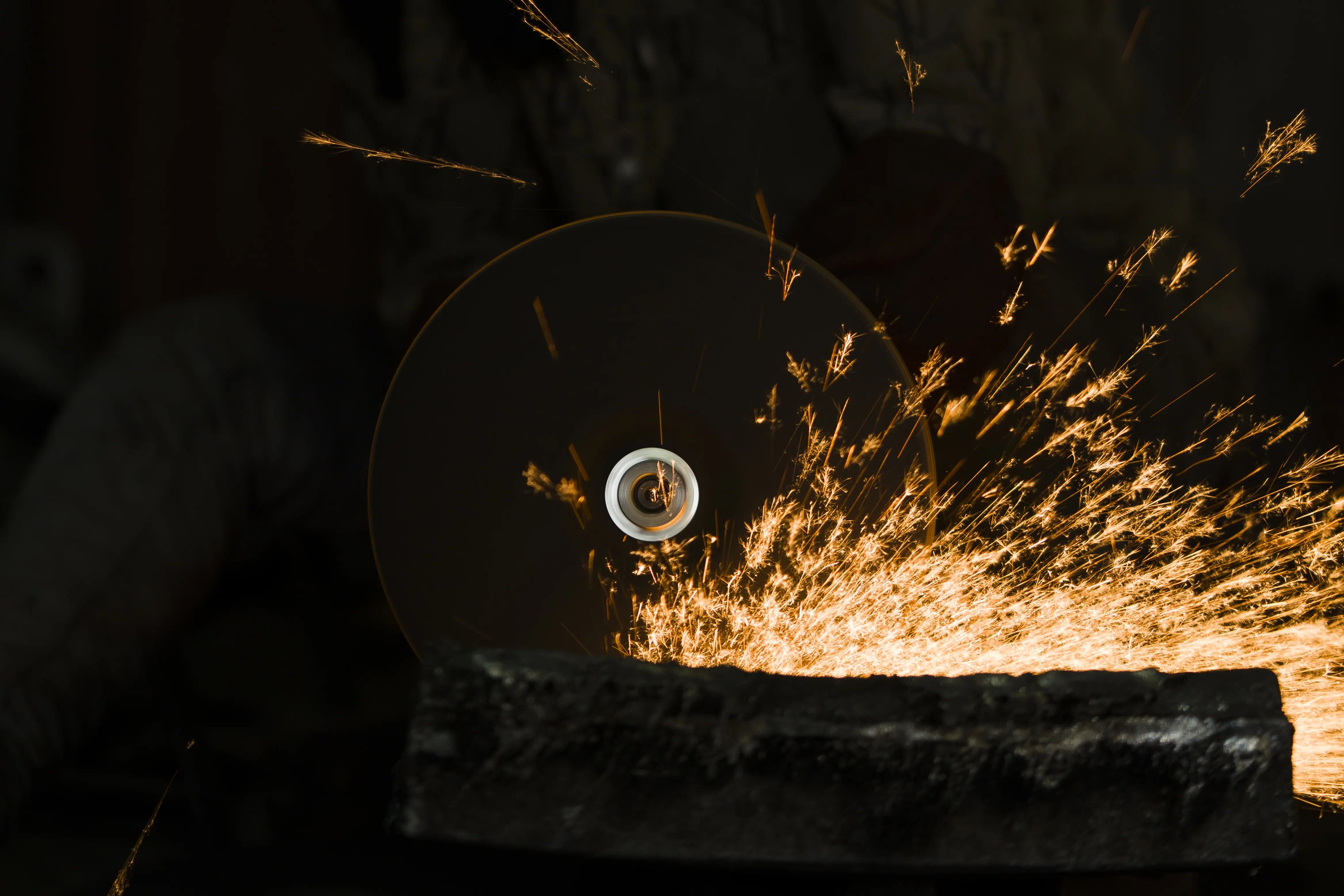 Abrasive cutting and grinding operation with sparks