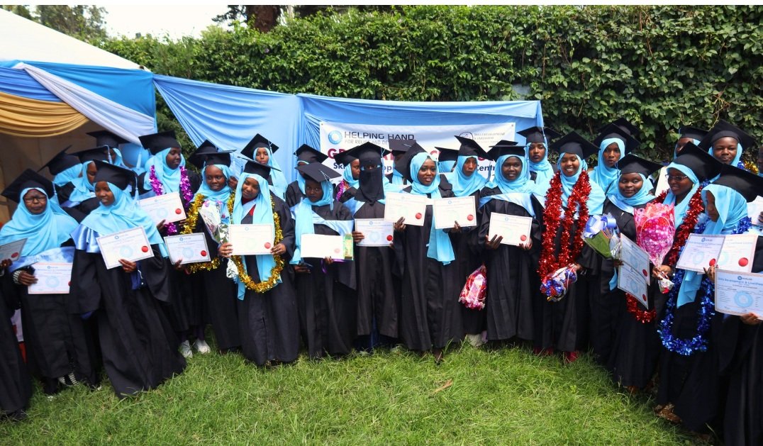 Students pose for a group photo during the graduation event