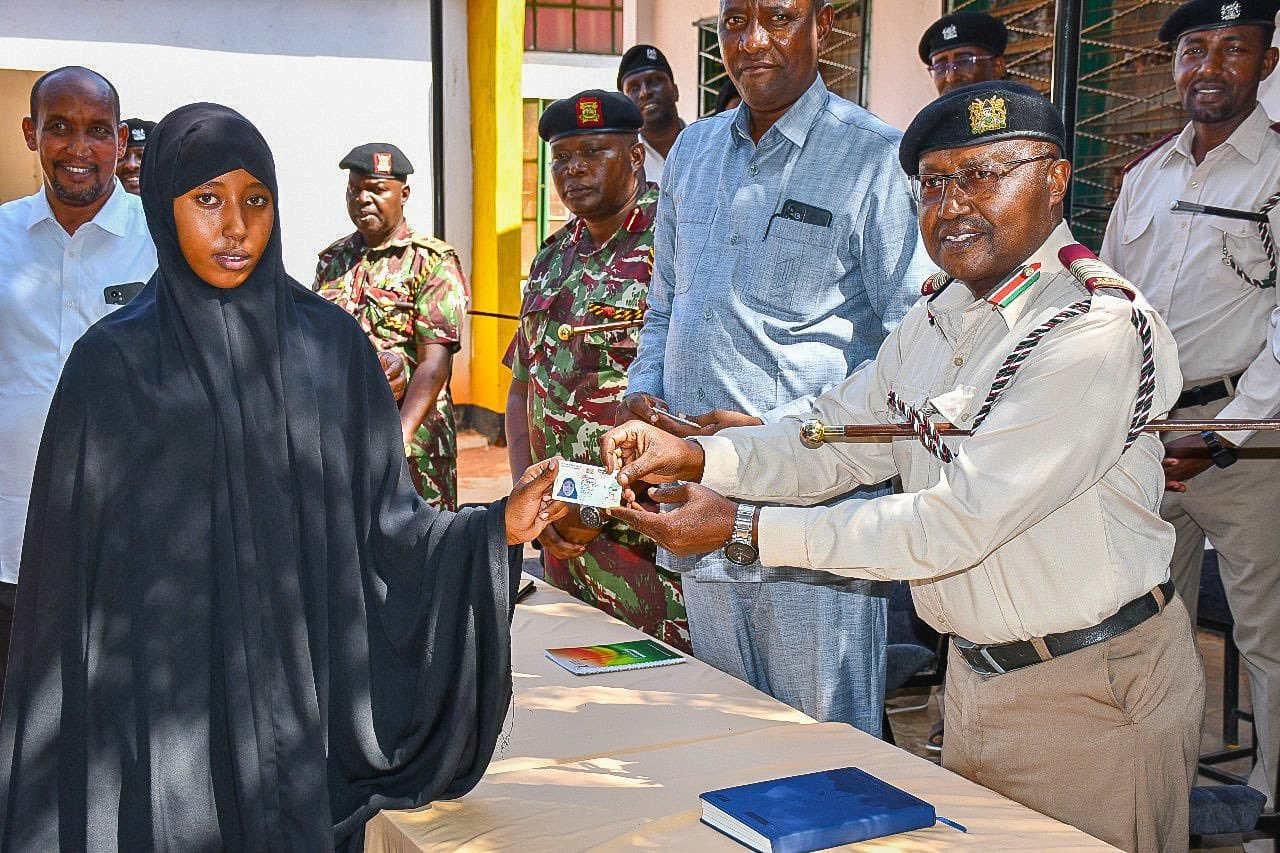 A student of Wajir Secondary School receives her national ID during the school registration drive 