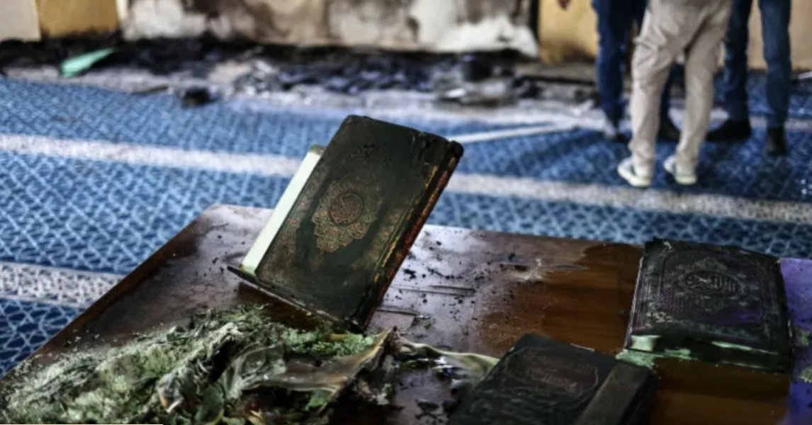 Scorched copies of the Quran inside the Hajja Hamida Mosque after it was set on fire and vandalised by Israeli settlers in the Palestinian village of Deir Istiya 