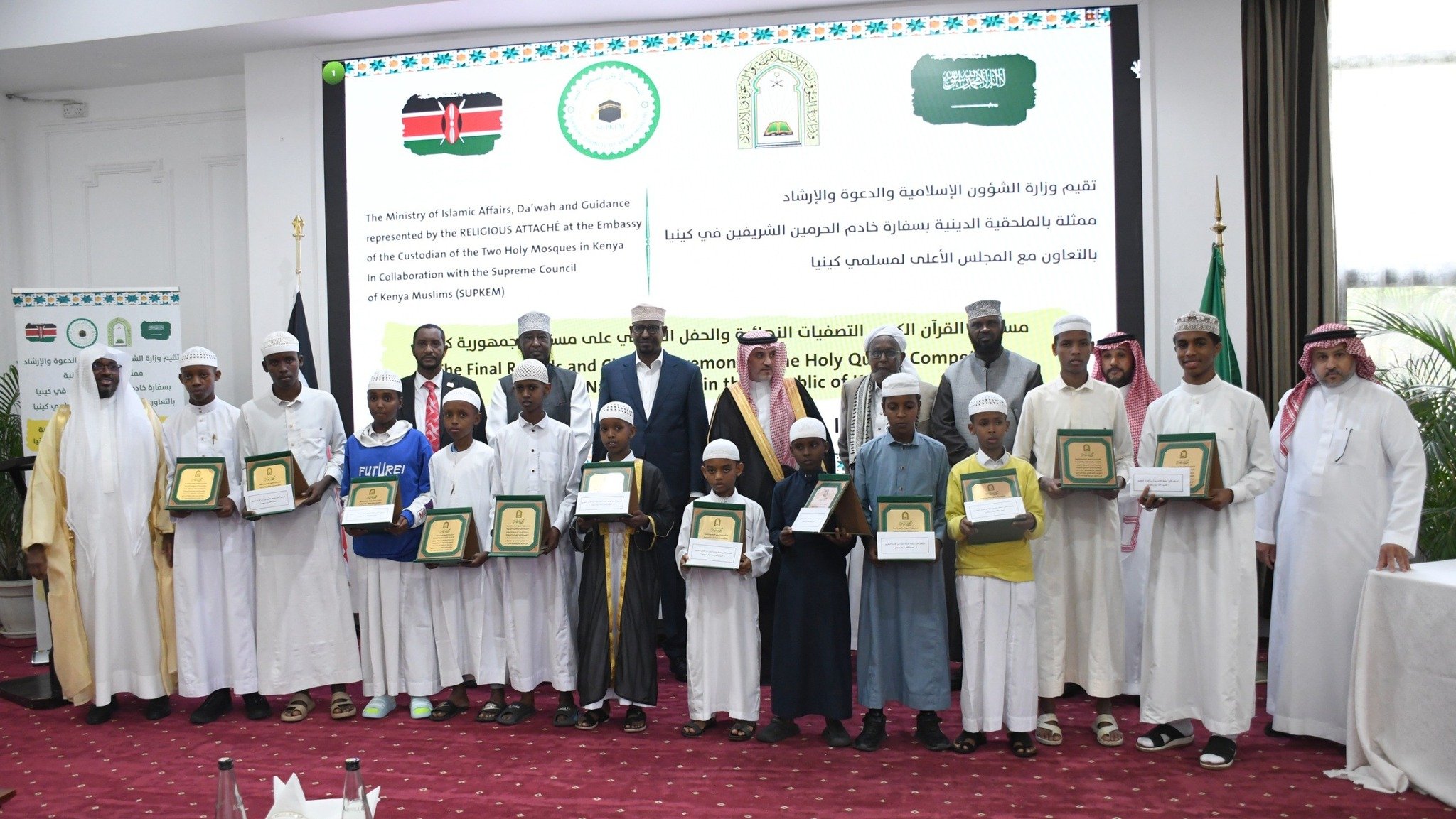 Winners in various categories display their prizes in a group photo
