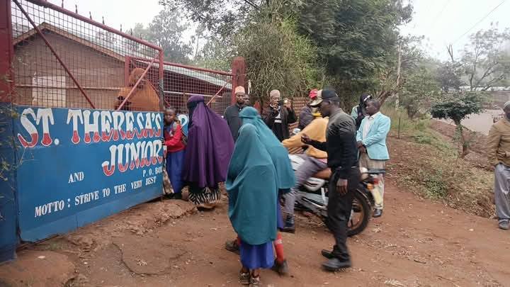 Muslim parents outside St Theresa Primary School demanding an end to the hijab ban