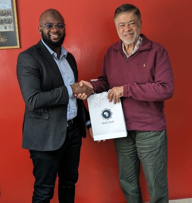 Feisal Kassim (Left) presenting a gift hamper to Fauz Qureishi, CEO of Kenya Bureau of Halal Certification (KBHC) during a past engagement