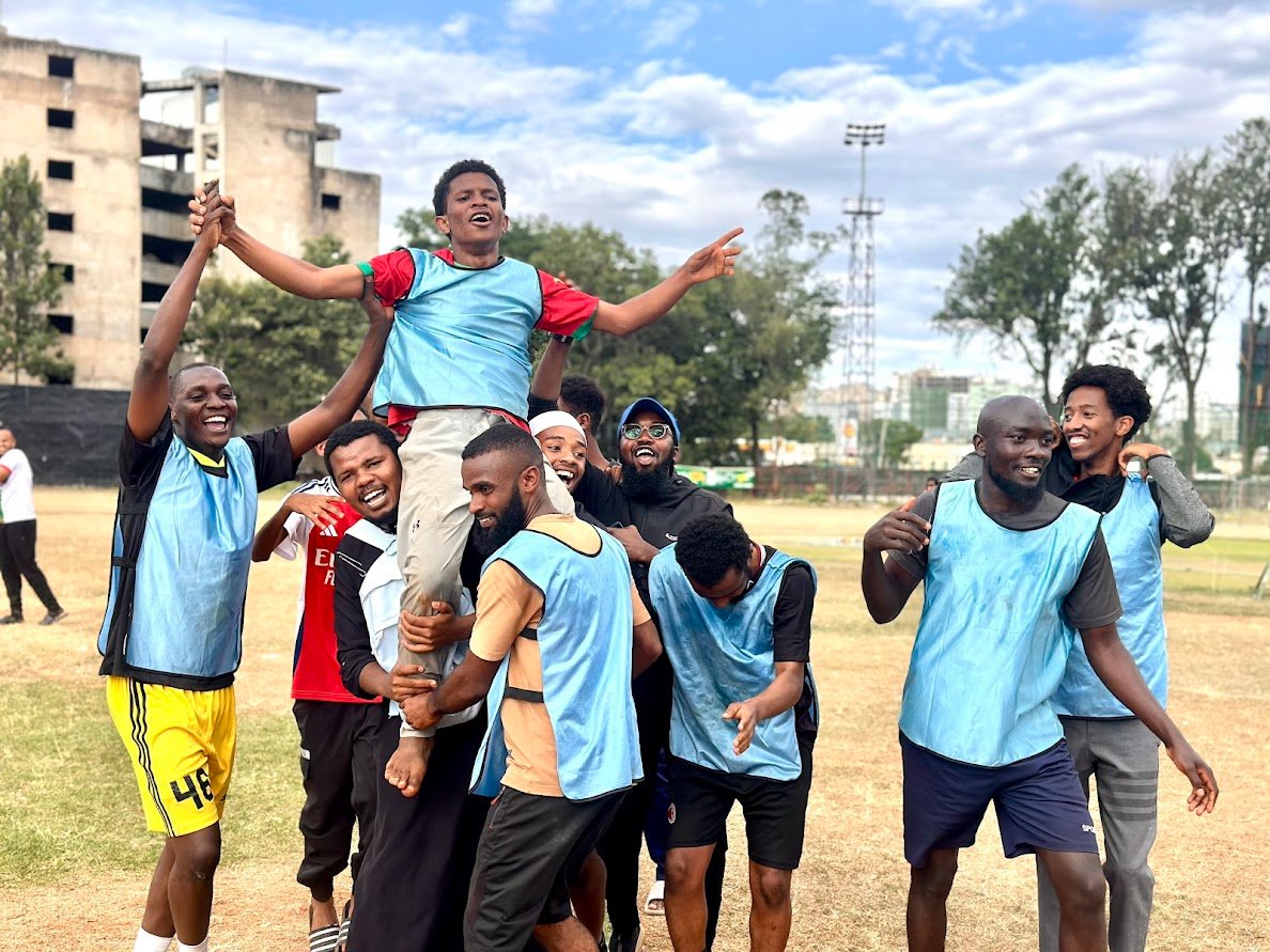 The top scorer Afham Omar is hoisted high by team mates