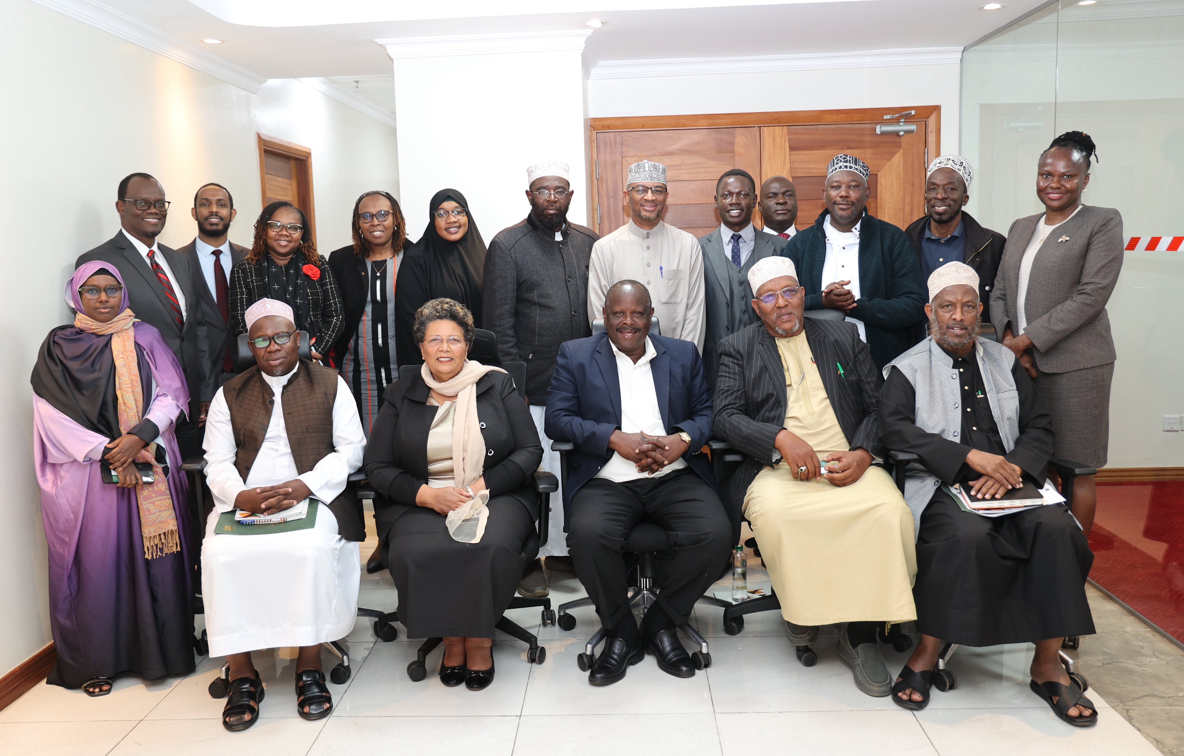 JSC Vice chairperson Issac Rutto (sitting centre) in a group photo with JSC officials and stakeholders from the Muslim community