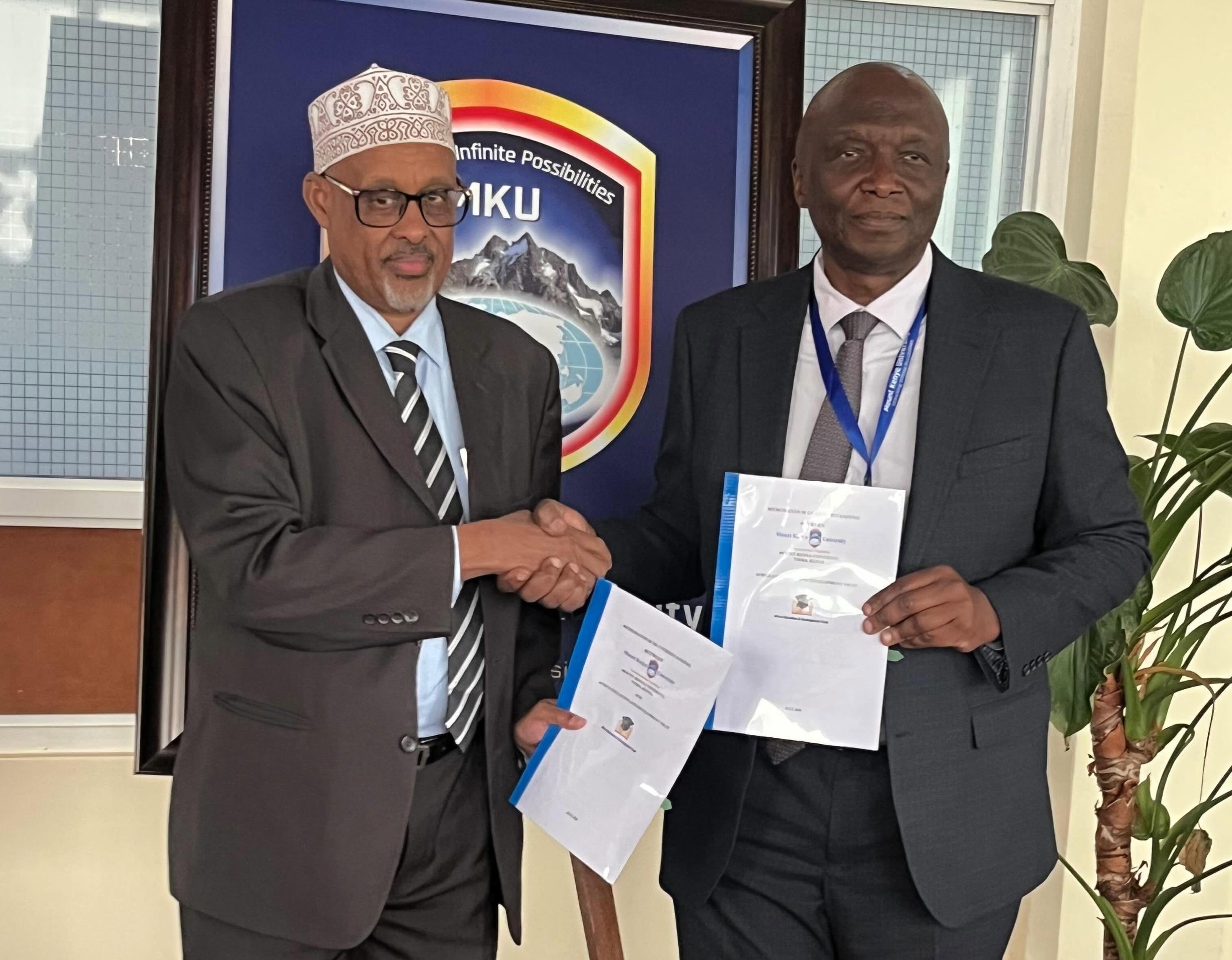 Africa Education and Development Trust (AEDT) Trustee Irshad Ibrahim and Mount Kenya University Vice-Chancellor Prof. Deogratius Jaganyi exchange copies of the Memorandum of Understanding