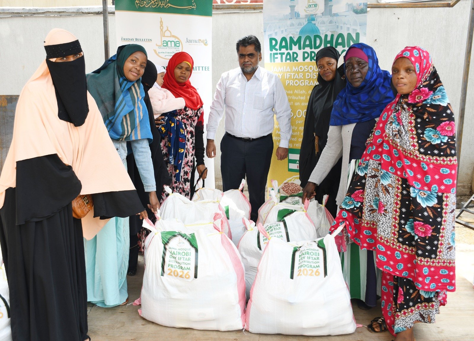 Some of the beneficiaries of the iftar programme with the Jamia mosque finance officer Aboobakar Nazir