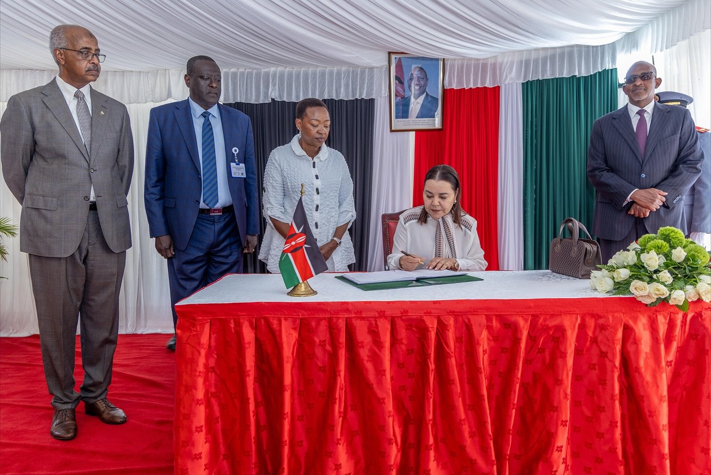 Princess Lalla Asma, accompanied by the First Lady Rachel Ruto, signs the visitors book at Kenyatta National Hospital. Looking on (from left) are KNH chairman Abbas Gullet, CEO Richard Lesiyampe and Health CS Aden Duale