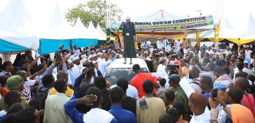Abdullahi Abbas stands atop the Probox vehicle he won for his masterly of the Qur'an