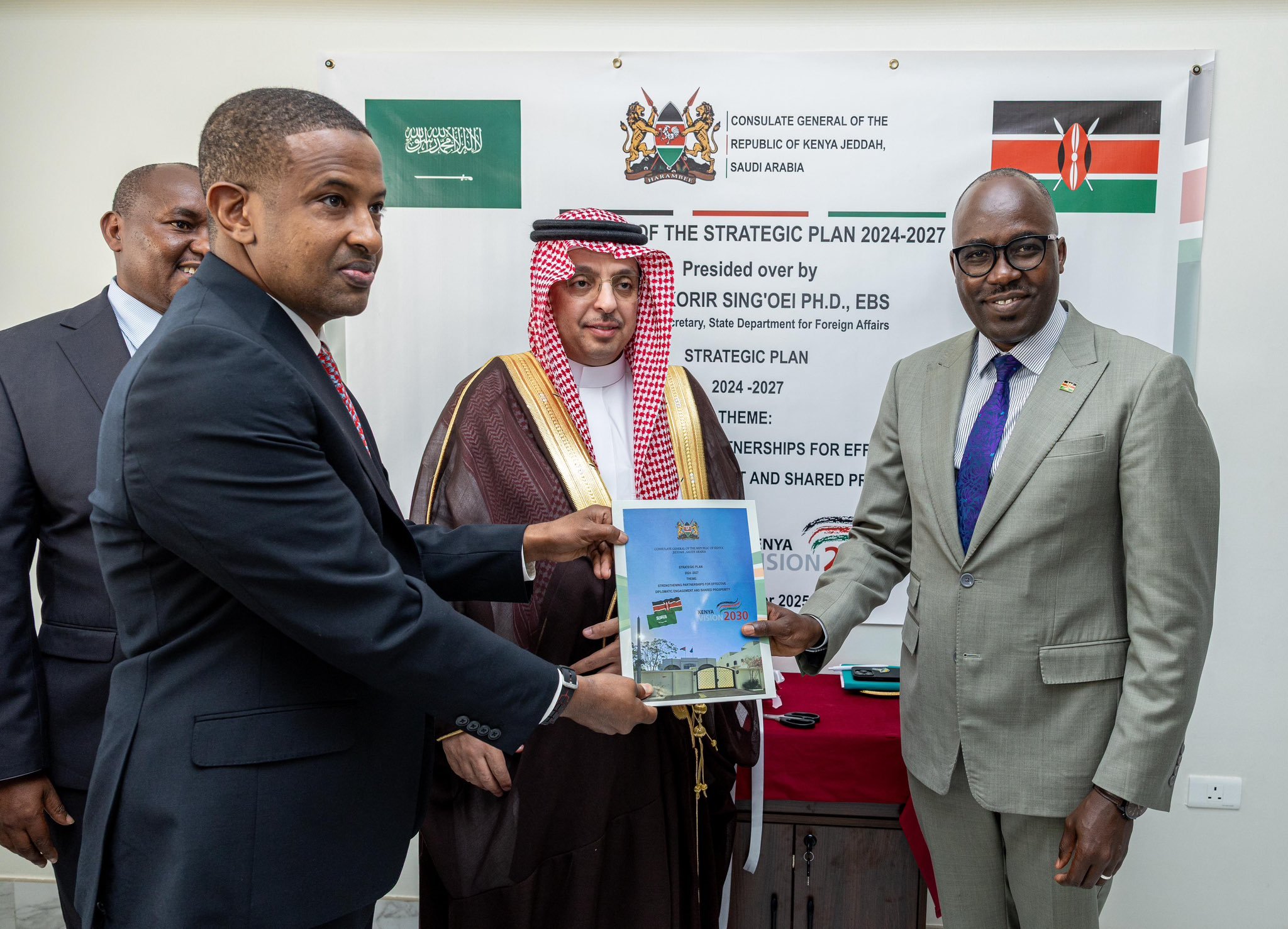 Foreign Affairs PS Dr Korir Sing'Oei (Right) with the Kenyan Consul General Aden Mohammed launching the strategic plan. Looking on is Fareed Al-Sheihri, Director General at the Ministry of Foreign Affairs of Saudi Arabia  