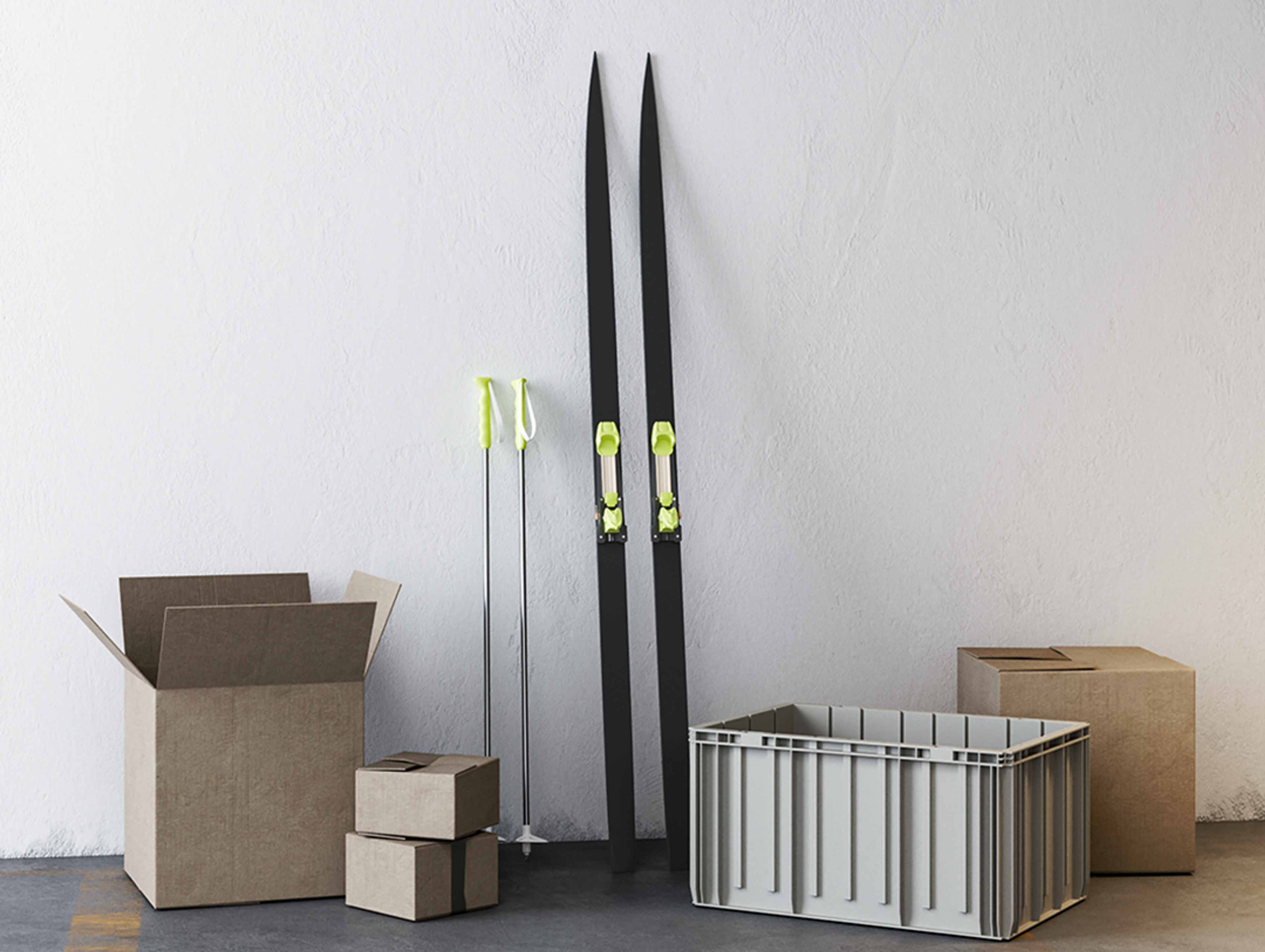 a pair of black skis and some boxes in a warehouse