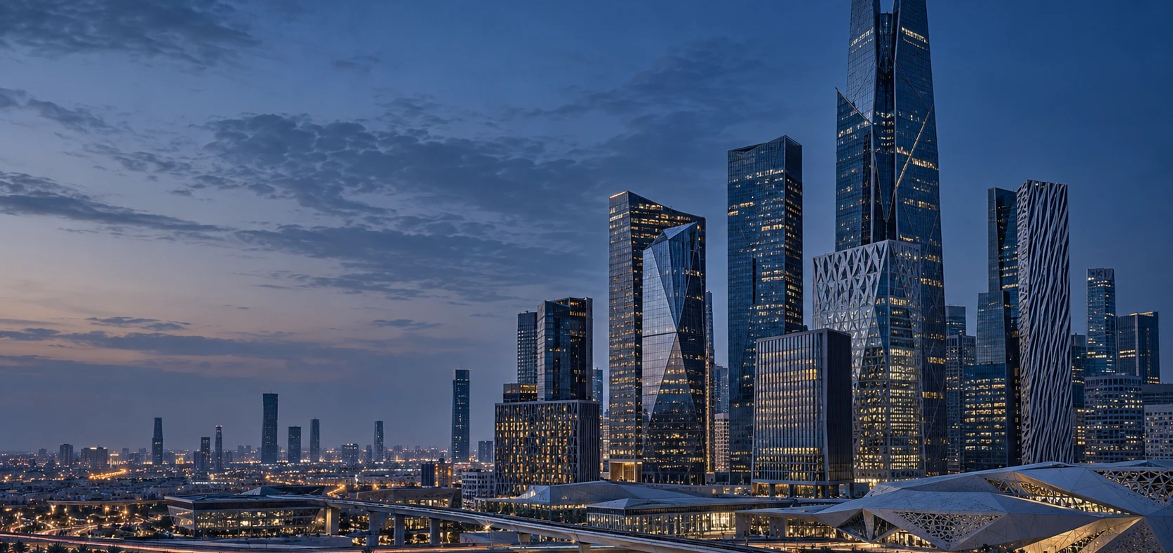The towers of the King Abdullah Financial District in Riyadh at dusk.
