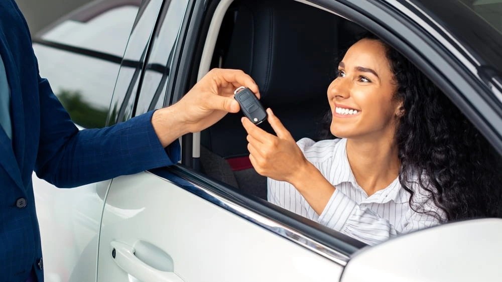 Vacation rental car keys and auto insurance policy