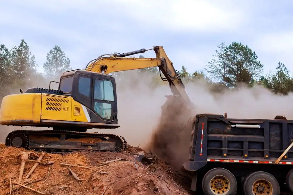 Contractor work vehicles at a Charleston SC area construction site where commercial auto insurance and inland marine coverage may help protect business vehicles and equipment.