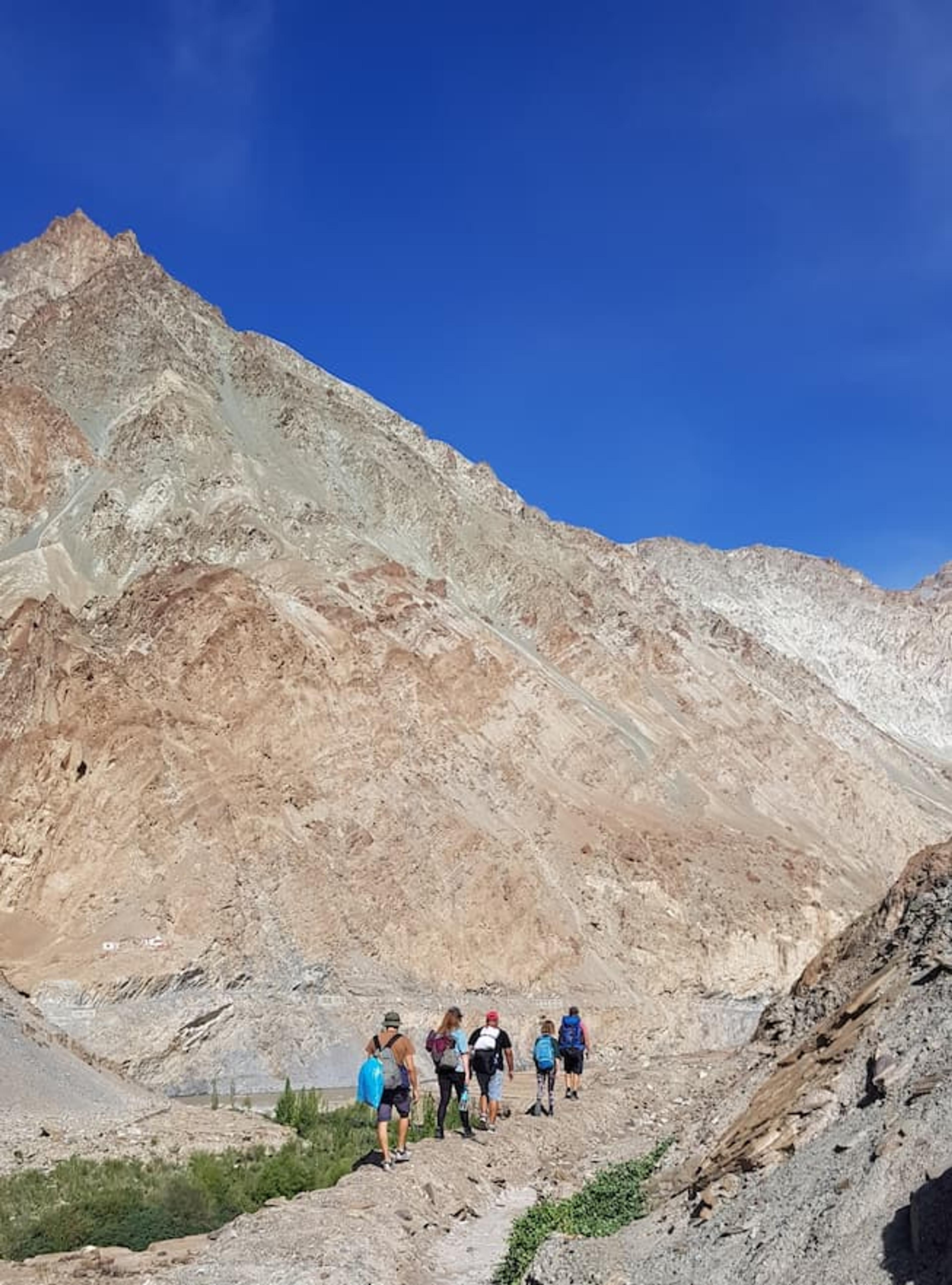 the group at the start of the trek, with a backdrop of mountains