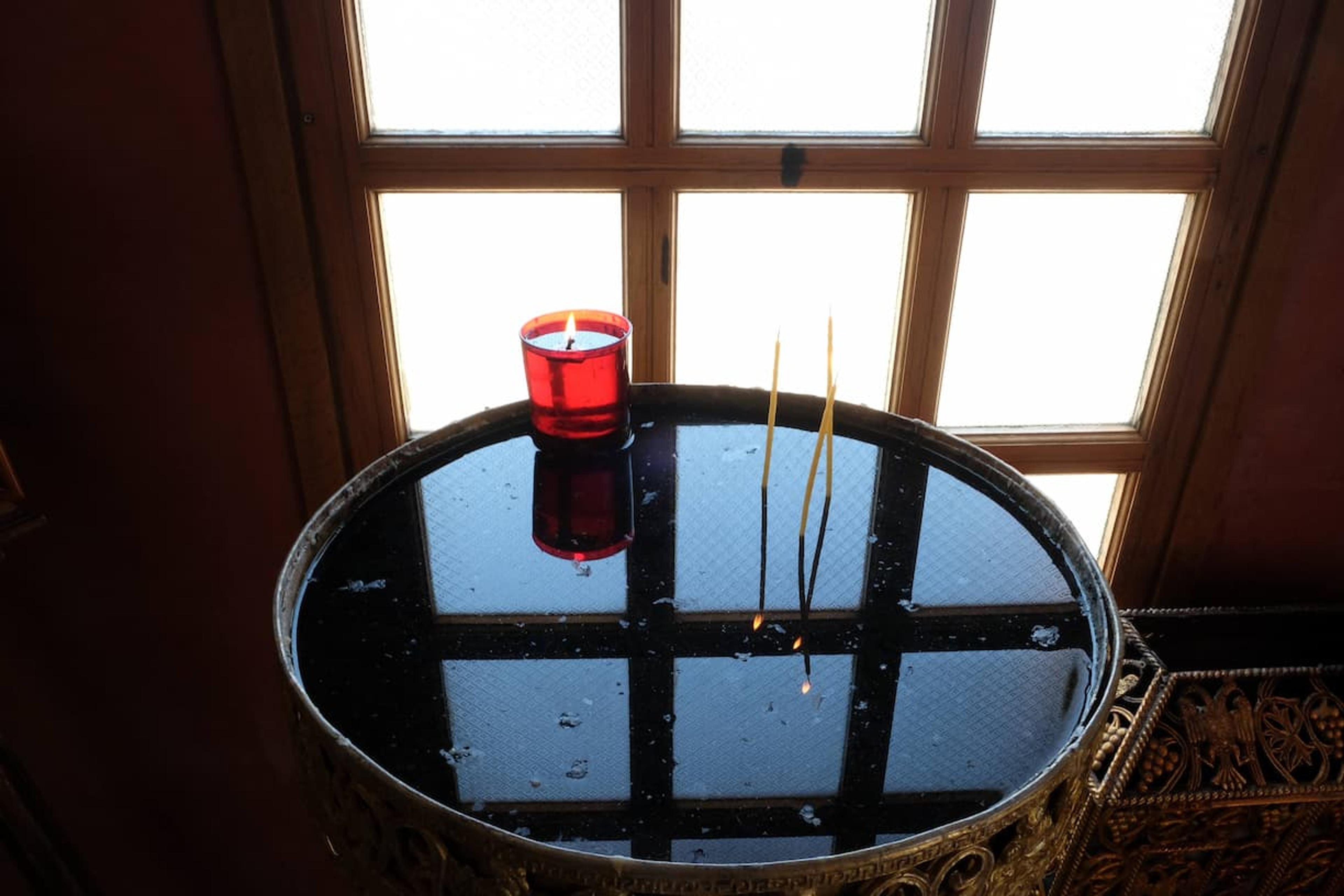 Lit candles in the chapel