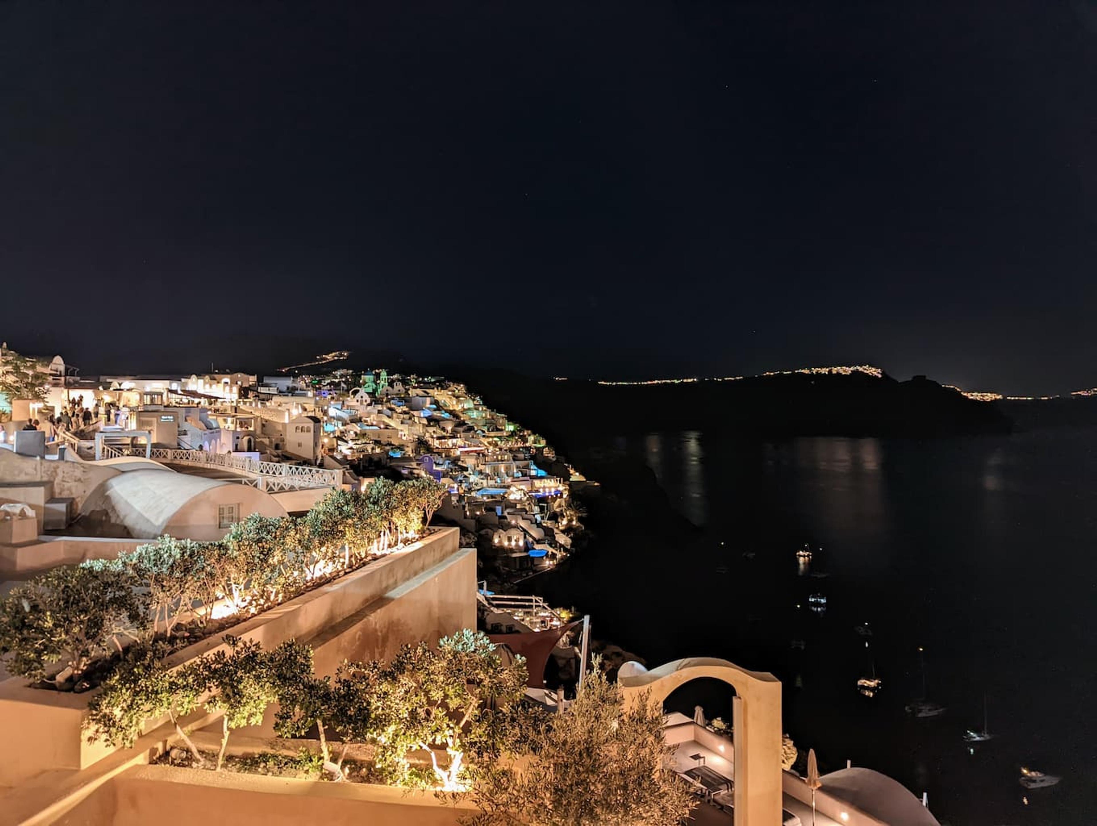 Oia lit up at night time