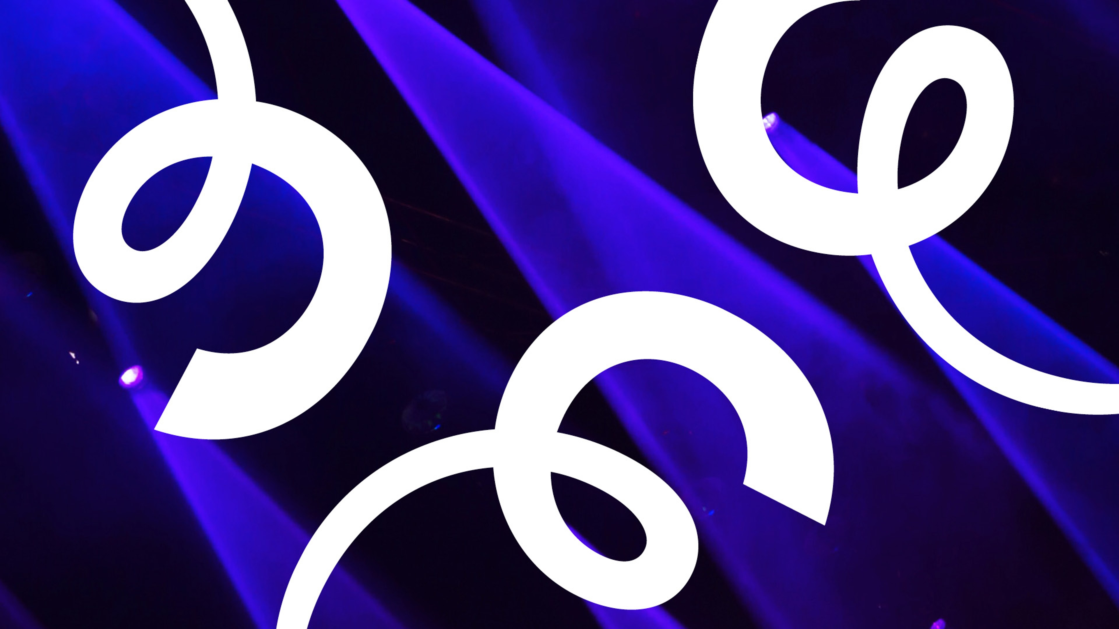 Blått strålkastarljus med vita trudelutter.