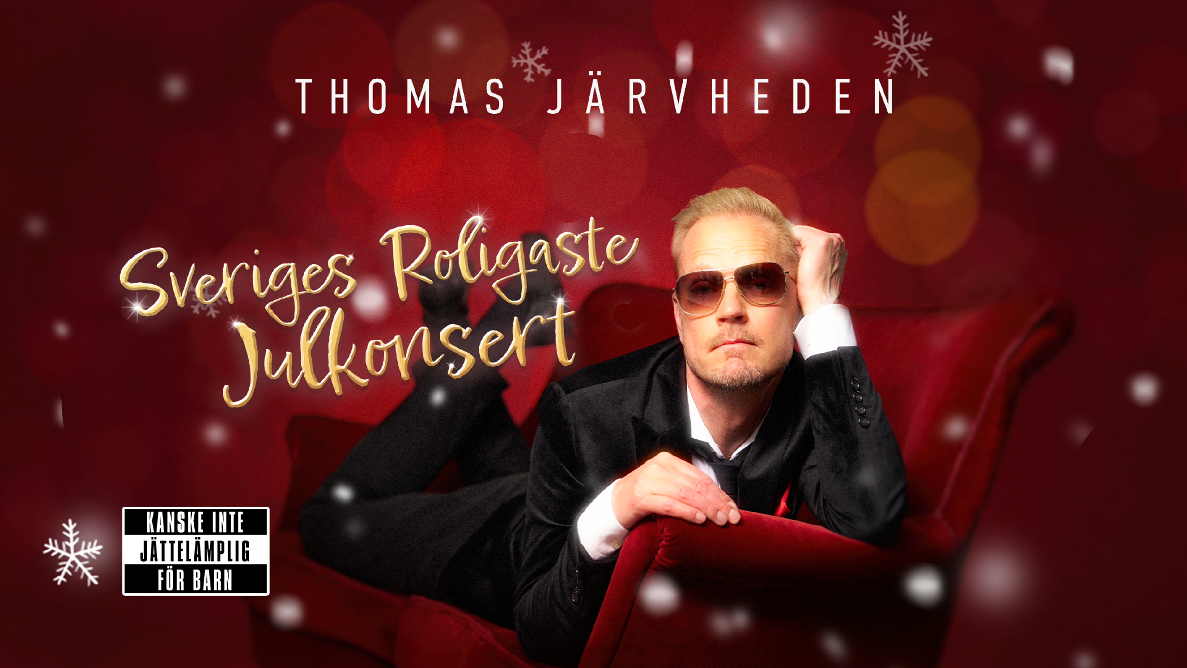 Thomas Järvheden liggandes i en röd soffa. Text: "Sveriges roligaste julkonsert".