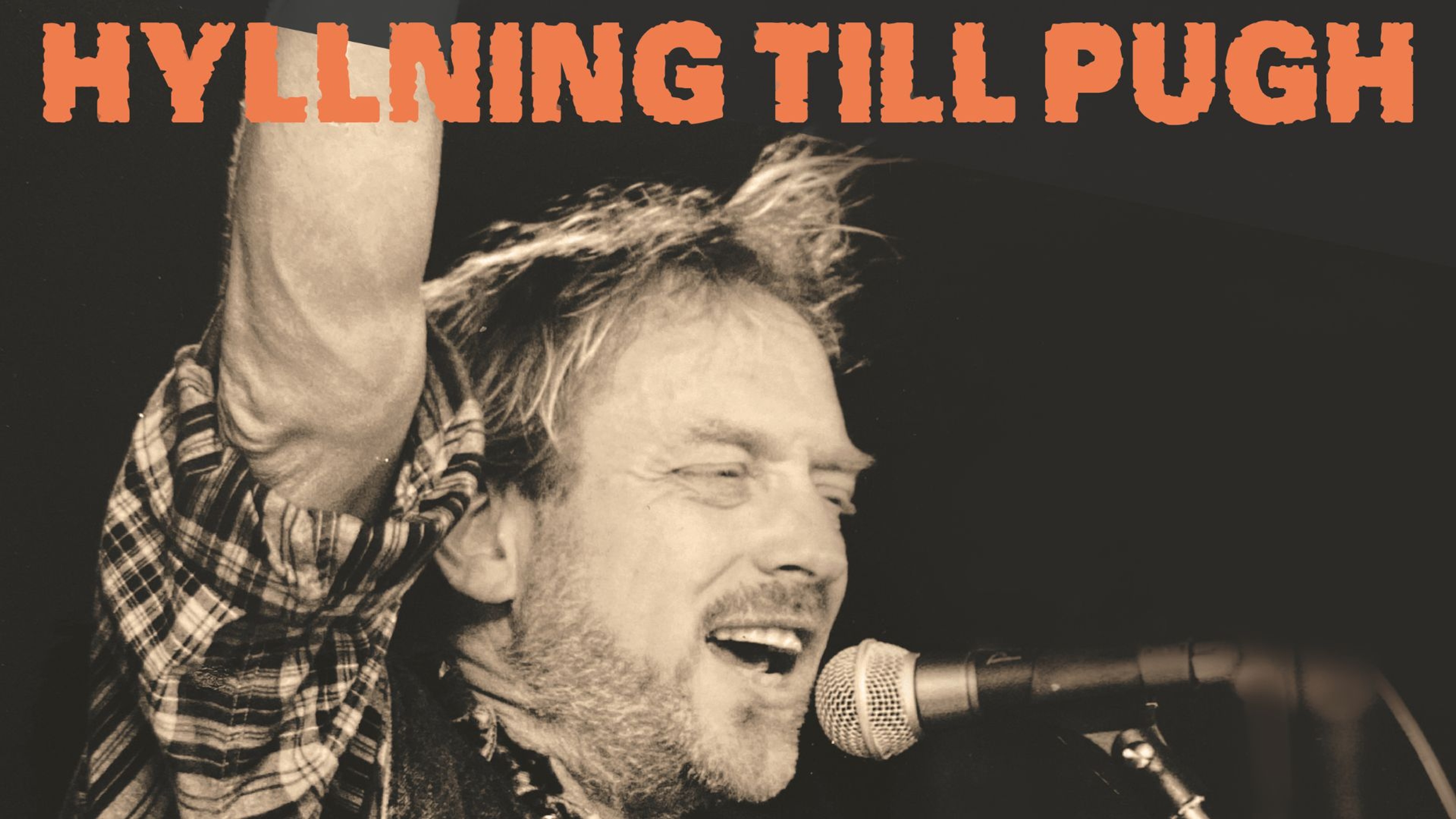 Pugh Rogefeldts ansikte och en mikrofon Bildtext: Hyllning till Pugh