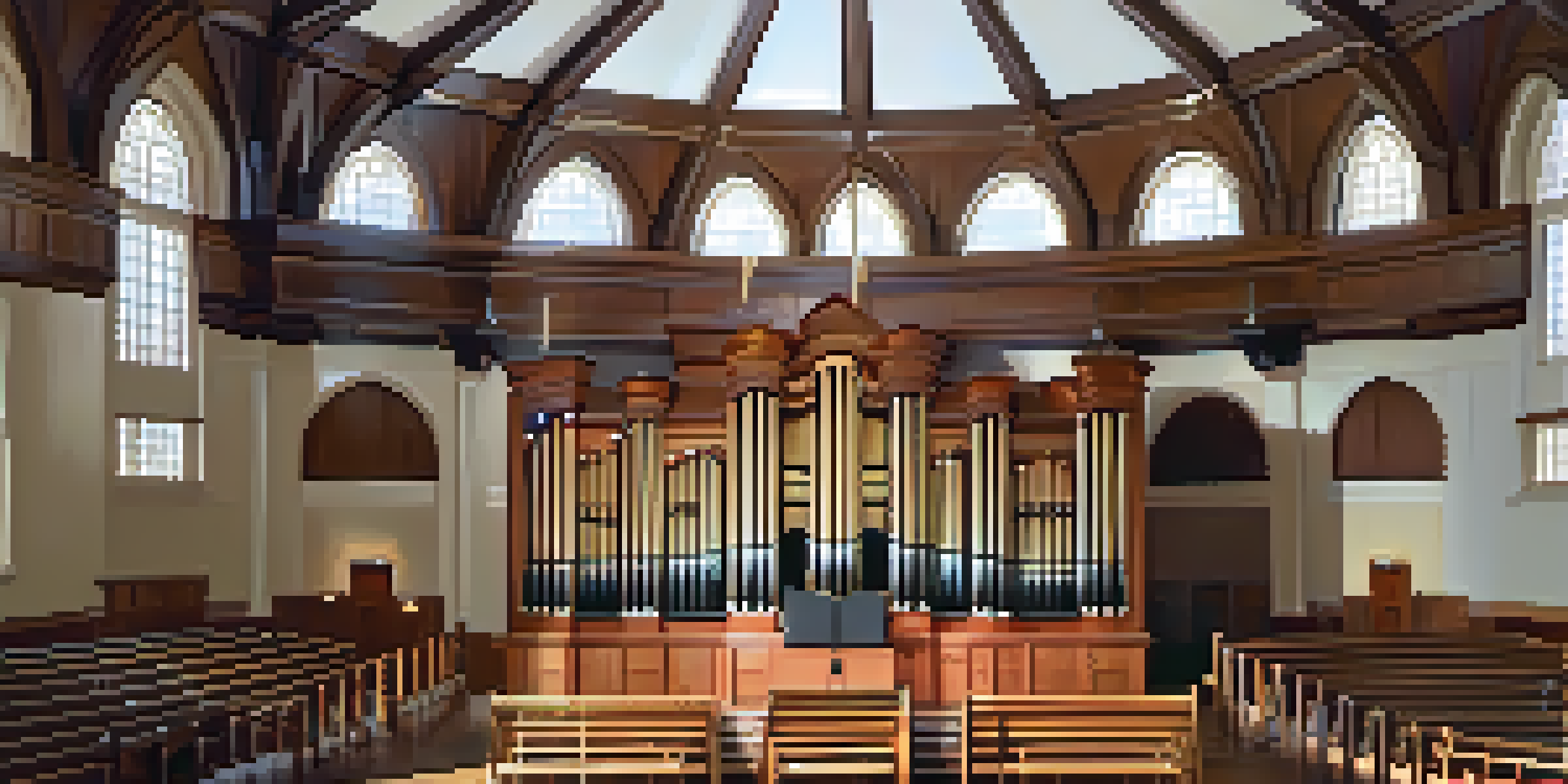 An interior view of the Historic Tabernacle highlighting its wooden dome and organ.