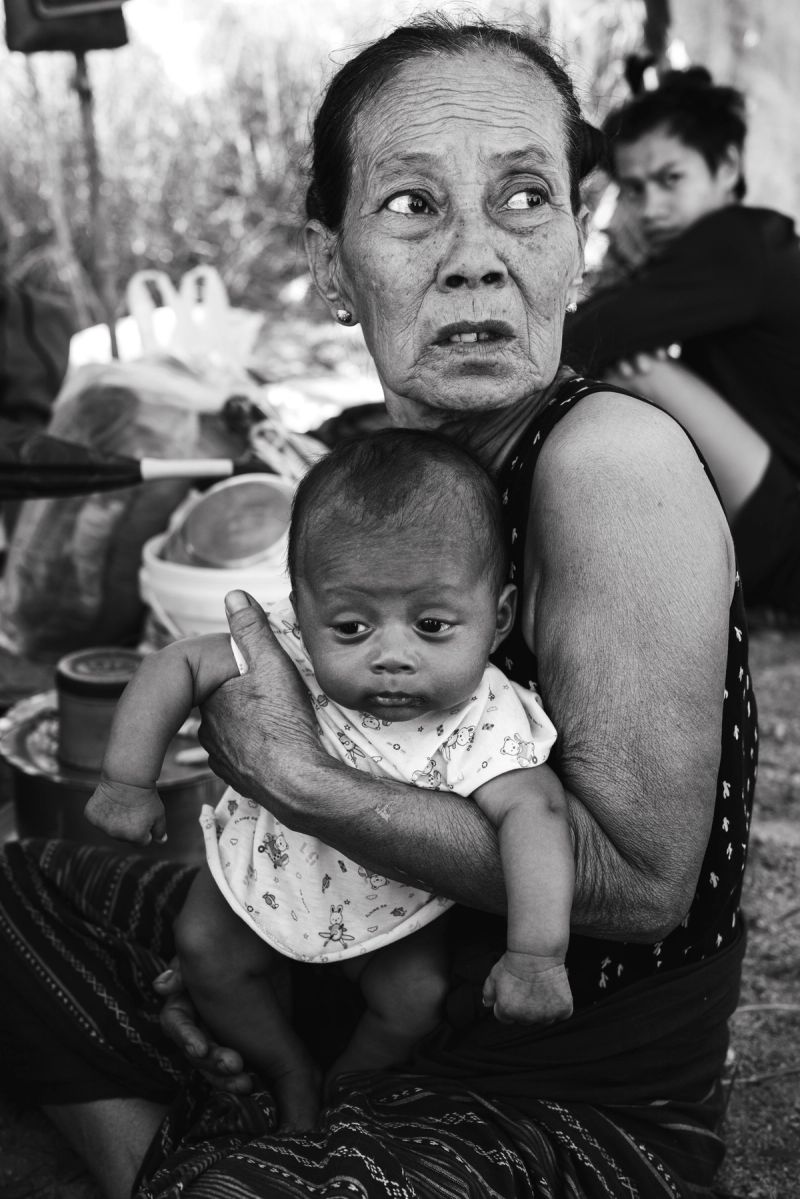 Generations in War: Displaced Bamar Grandmother and Infant on the Thai Myanmar Border, 2021. © Aung Naing Soe