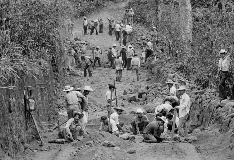 Laborers repair a road for a work-for-pay-and-food construction program sponsored by the United States Agency for International Development, USAID, in San Vicente, El Salvador, April 1, 1983. © Nickelsberg