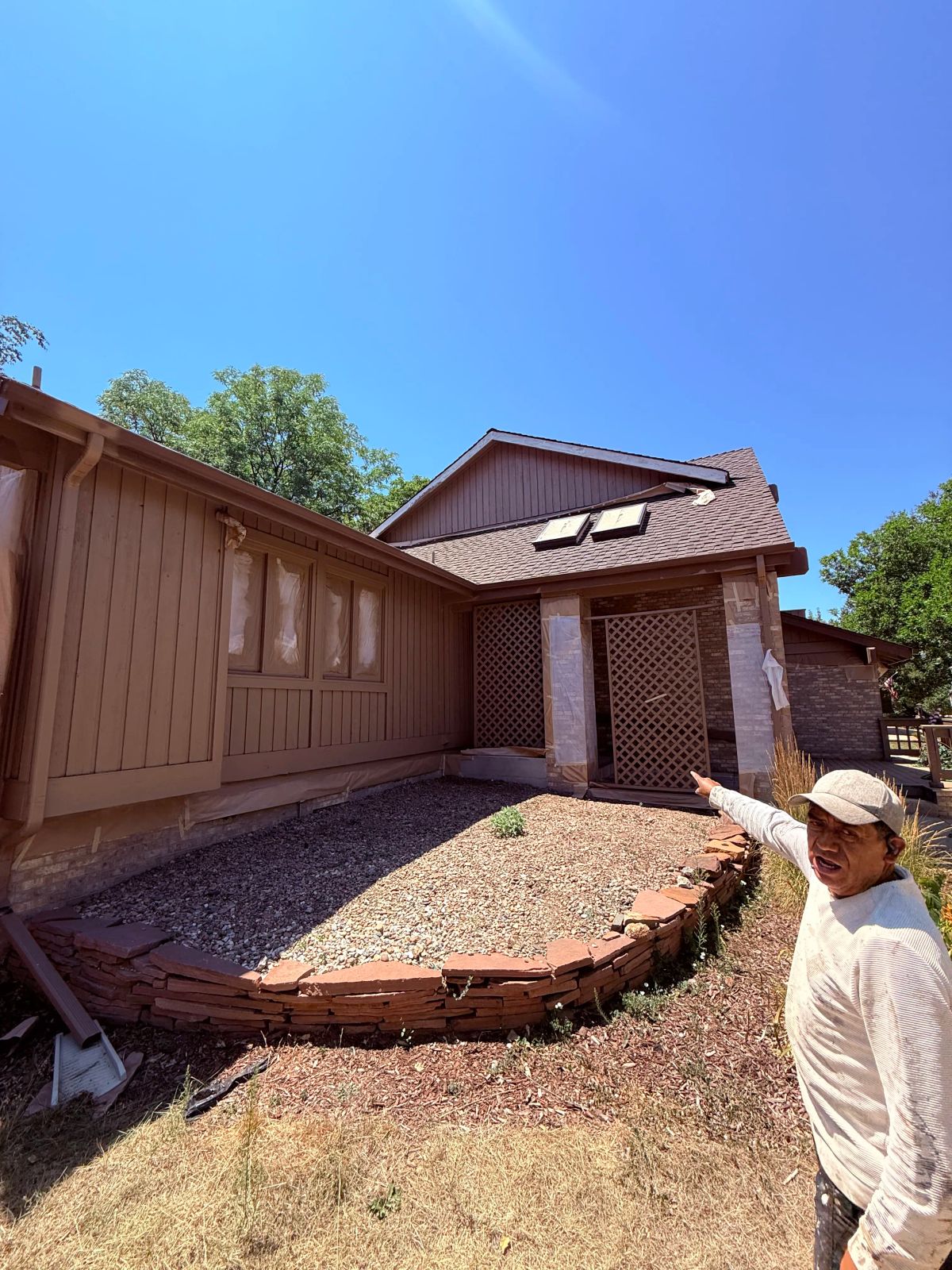 Stone-edged gravel bed, house exterior— Denver