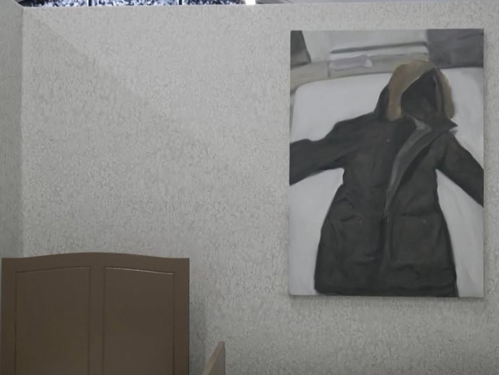 Hooded coat on bed