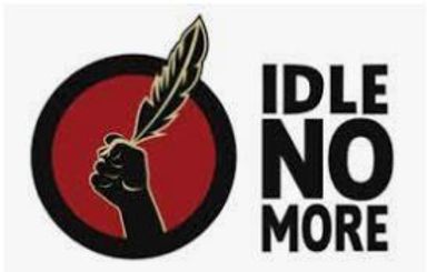 Logo that includes a red circle with a hand holding a feather. To the right of the image, text reads: “Idle NO More.”  