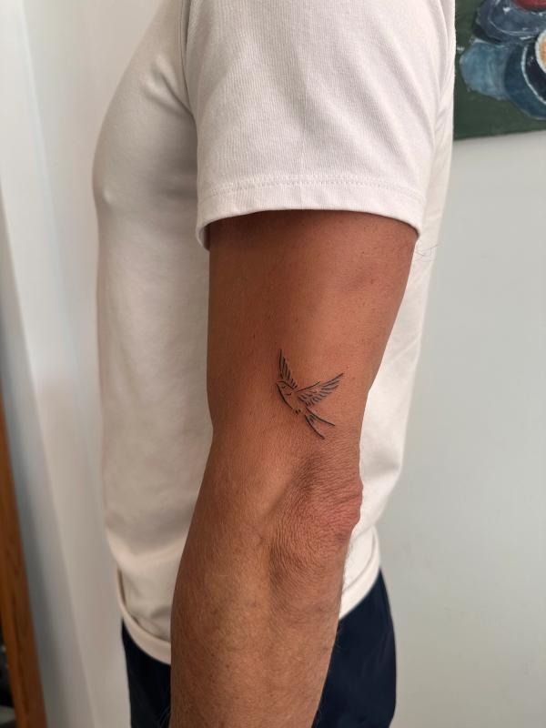 Small bird tattoo