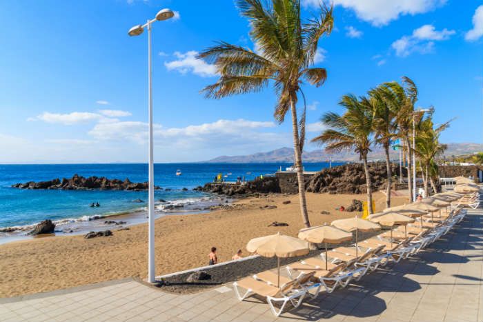 Sunbeds on beach at Puerto del Carmen, Lanzarote