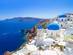 Oia town on Santorini island, Greece with blue-domed churches and white-washed buildings