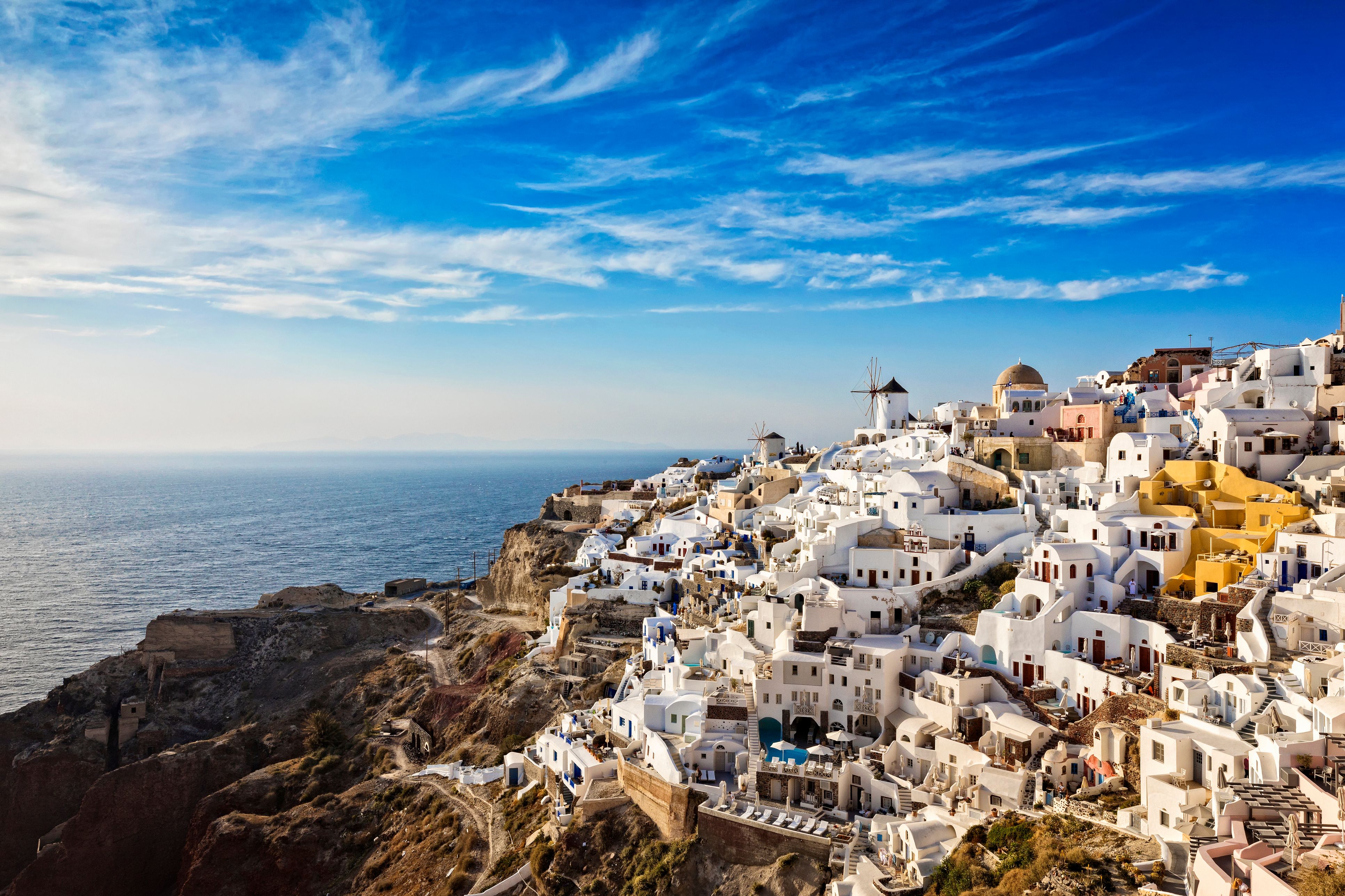 An aerial view over the clifftop town of Oia in Santorini, Greece