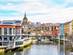 A view down the Nervion River in Bilbao, Spain, lined with colourful buildings