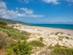 A view across grassy sand dunes of Bolonia beach in Tarifa near Cadiz