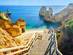 Wooden staircase leading down to Praia do Camilo beach near Lagos in the Algarve, Portugal
