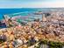 Alicante city panoramic aerial view with seaside, harbour and houses