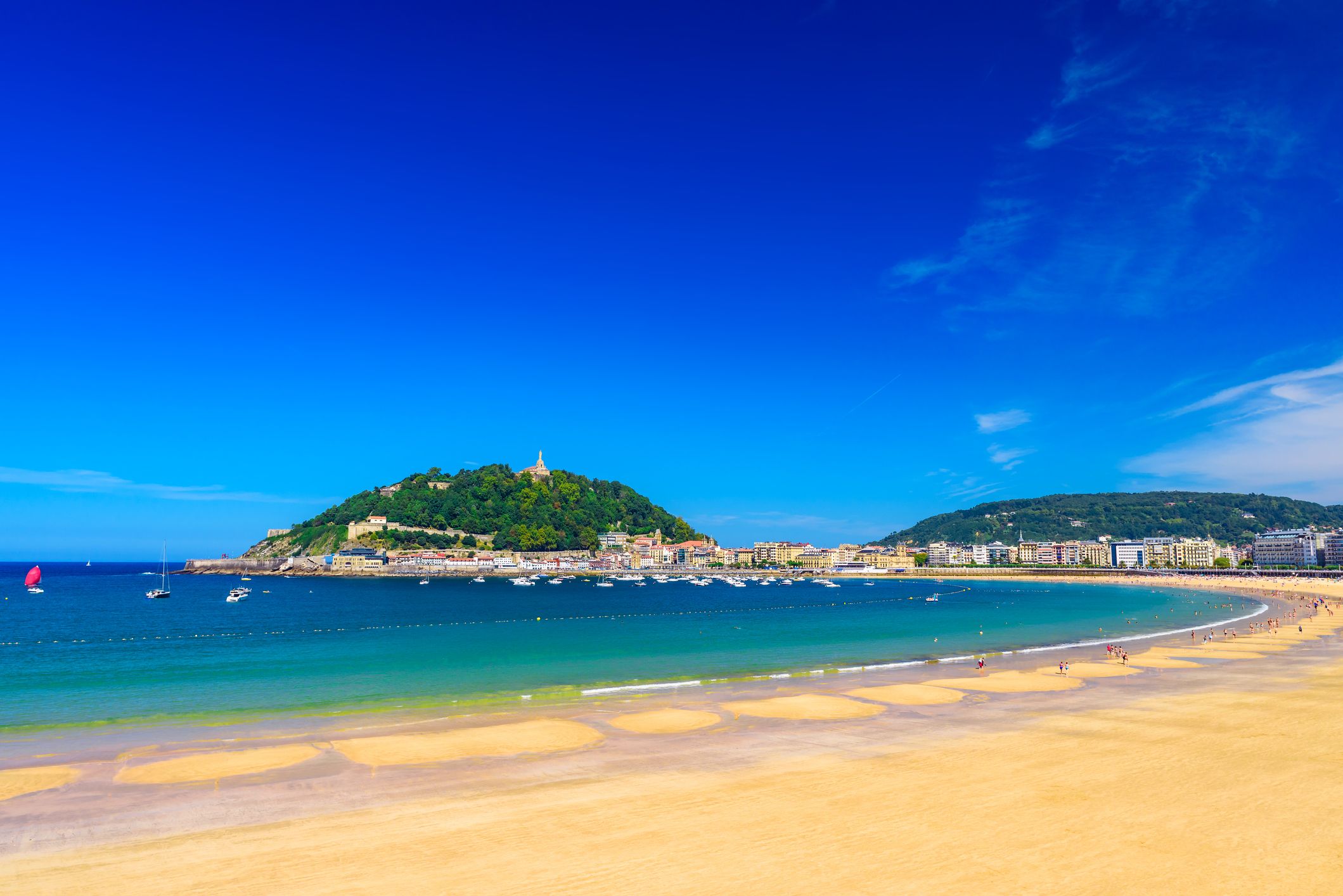 A view across the sand of La Concha beach in San Sebastián, Spain