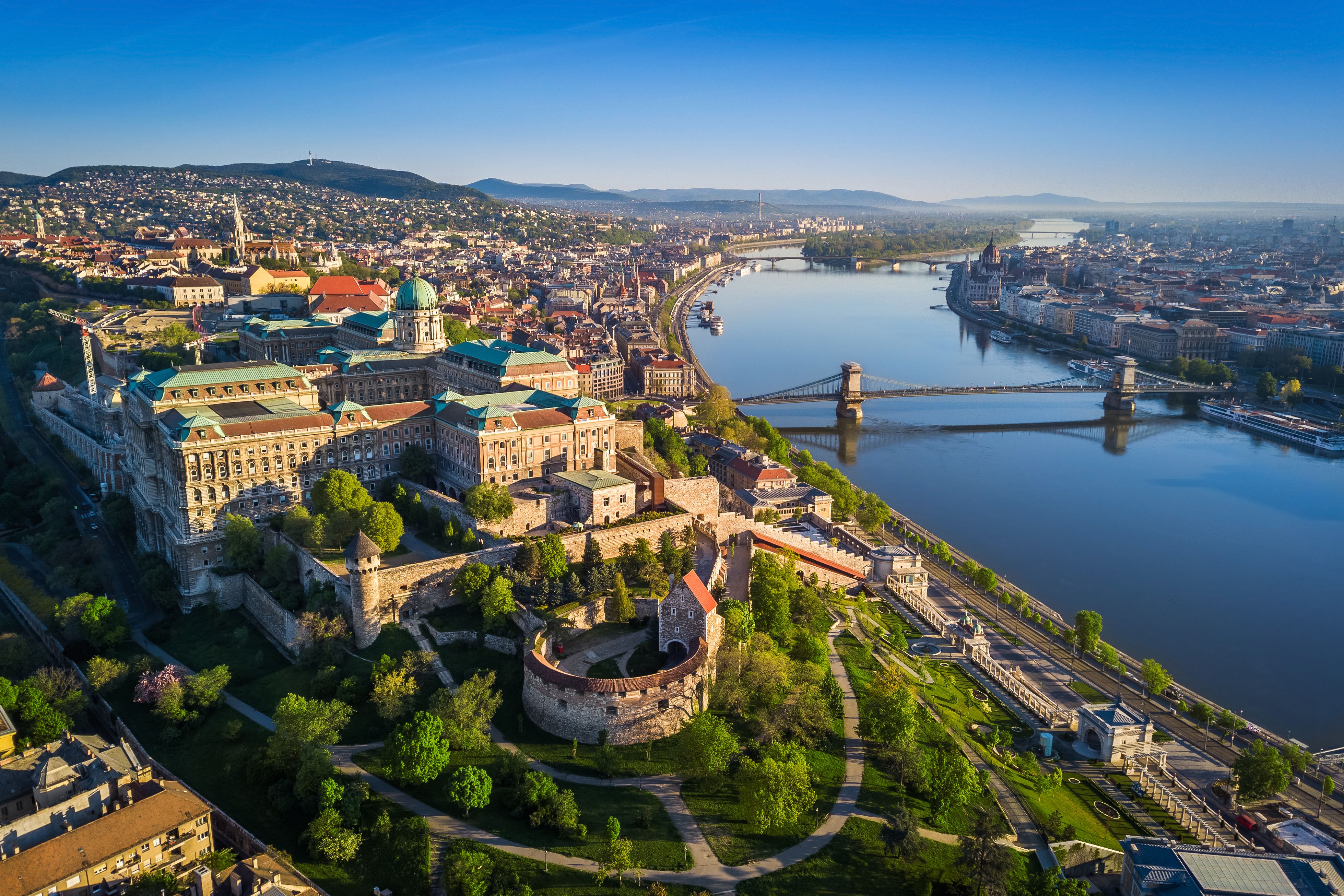 Aerial skyline view of Budapest at sunrise with Szechenyi Chain Bridge and Buda Castle in the foreground