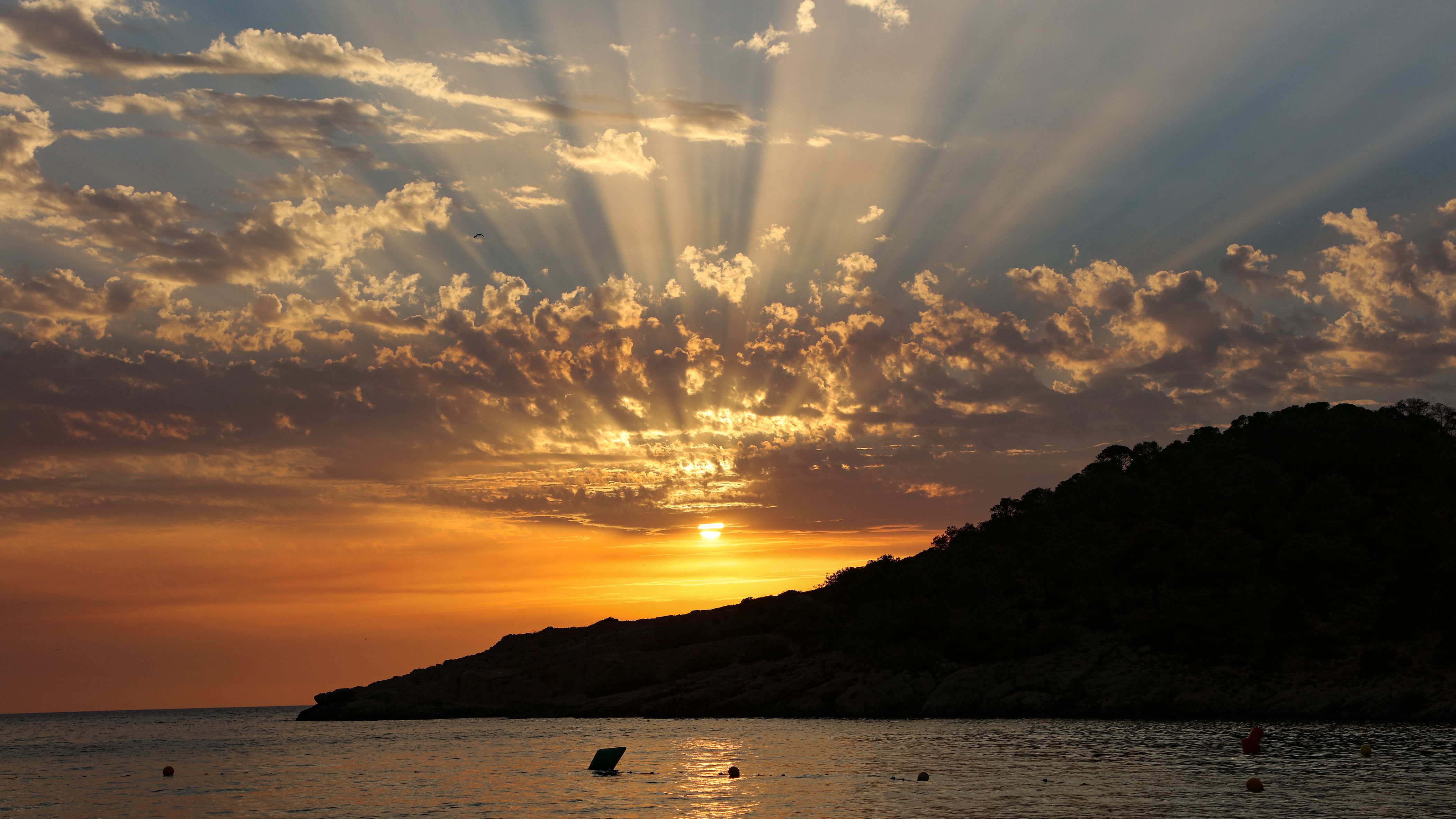 A sunset view from Cala Salada beach in Ibiza